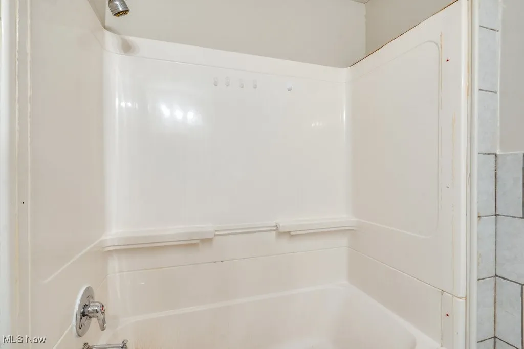 Bathroom with bathtub / shower combination