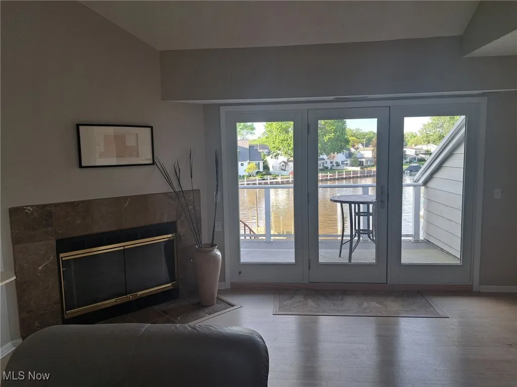 Entryway featuring a water view, and a  fireplace