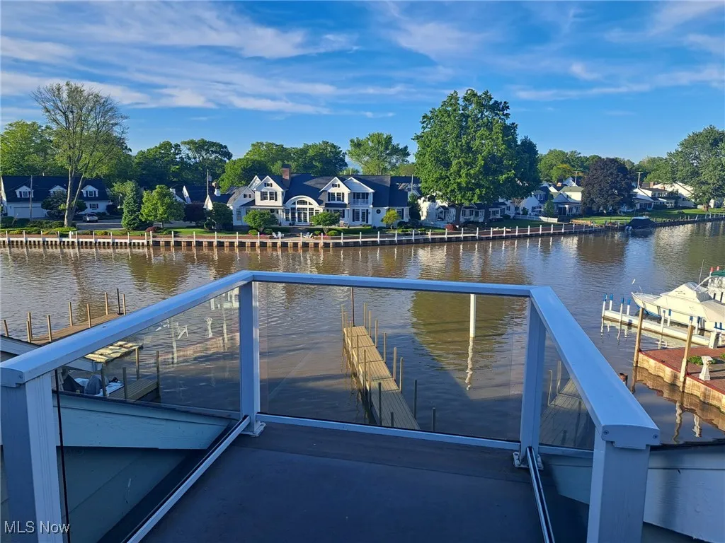3rd deck patio featuring a water view and a residential view