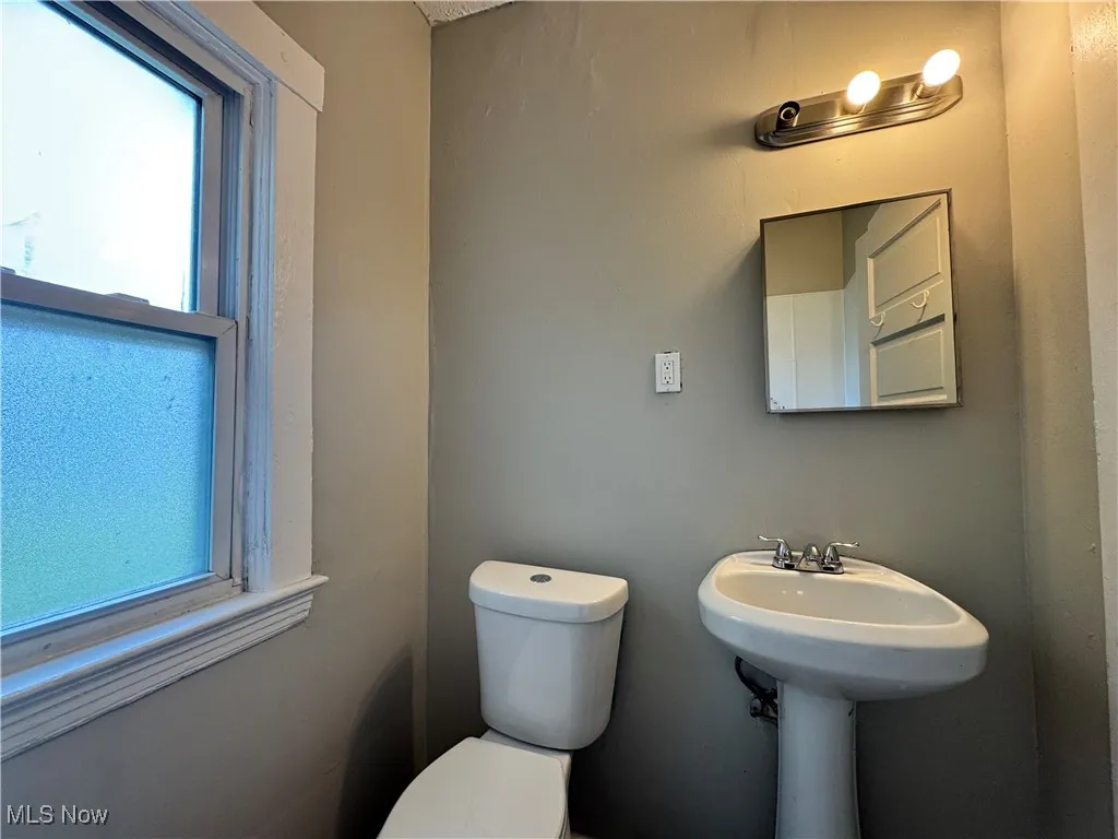 Half bath with toilet and plenty of natural light
