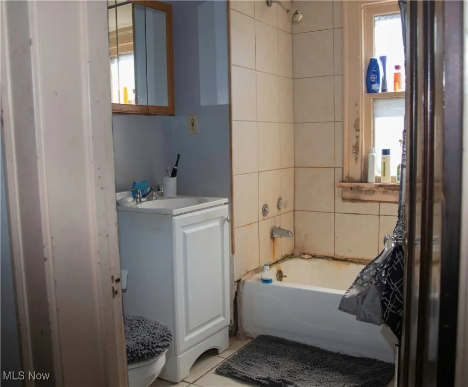 Bathroom featuring vanity and tile patterned floors