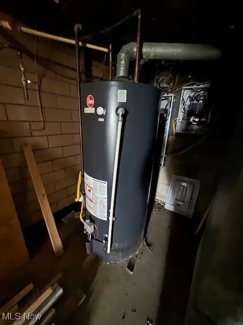 Utility room featuring gas water heater
