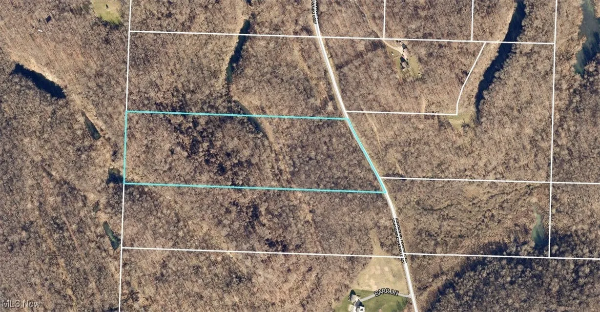 Aerial map of property and surrounding area with property parcel outlined