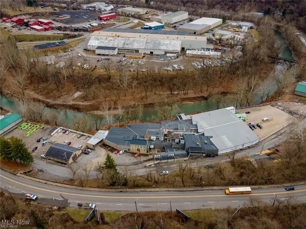 Aerial overview of property's location featuring industrial structures