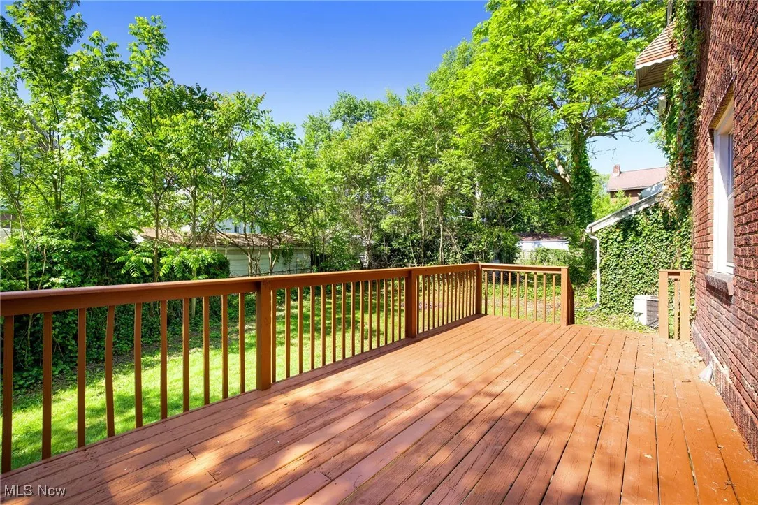Wooden terrace with a yard and central air condition unit