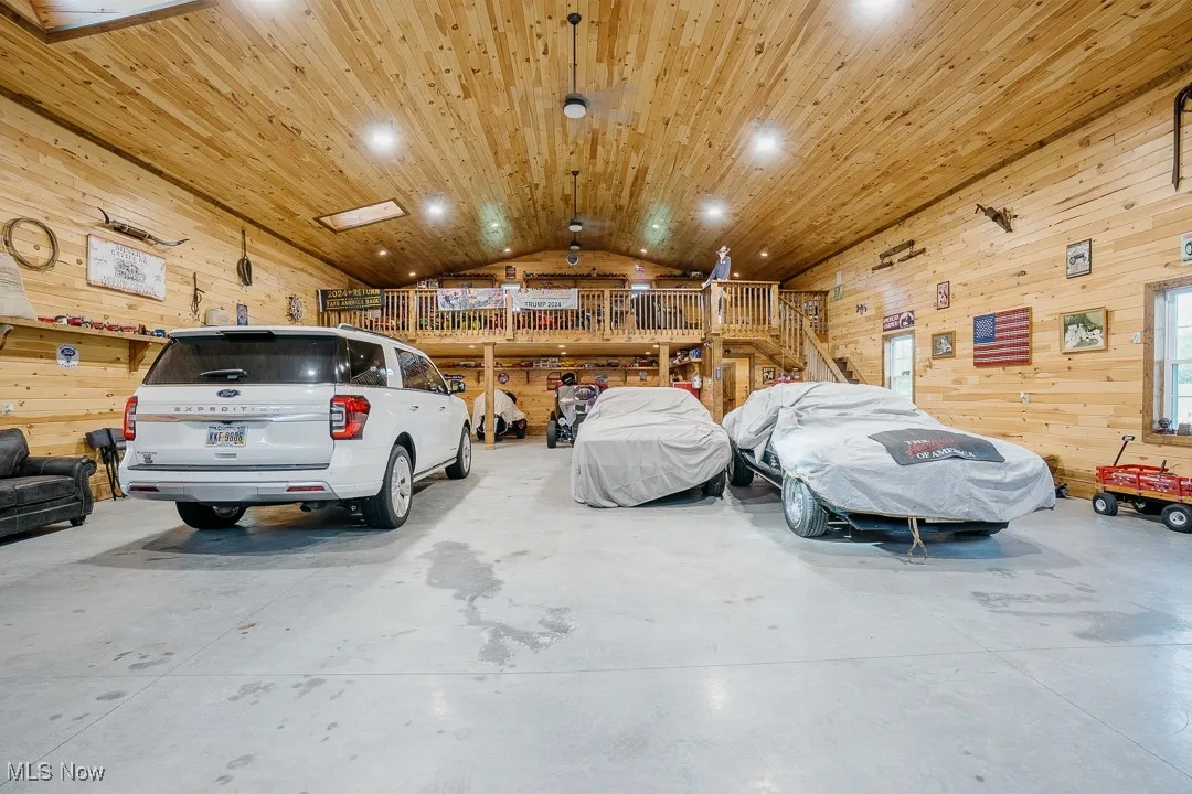 Garage with wooden walls and recessed lighting