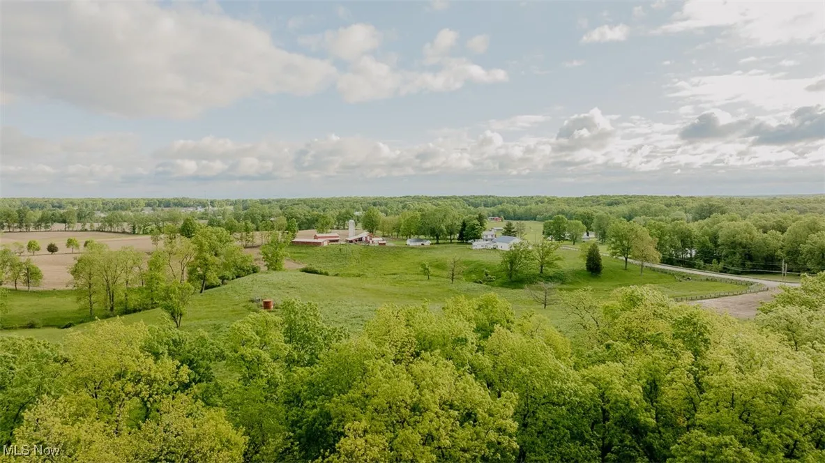 View of rural area with a heavily wooded area