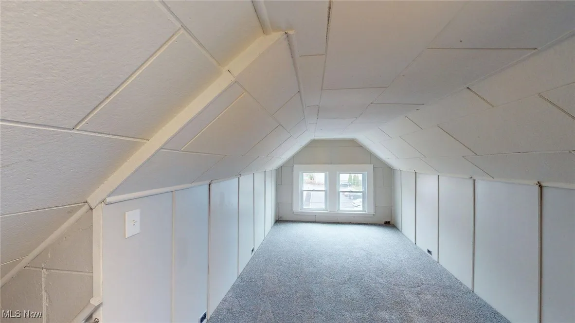 Bonus room with lofted ceiling and carpet floors