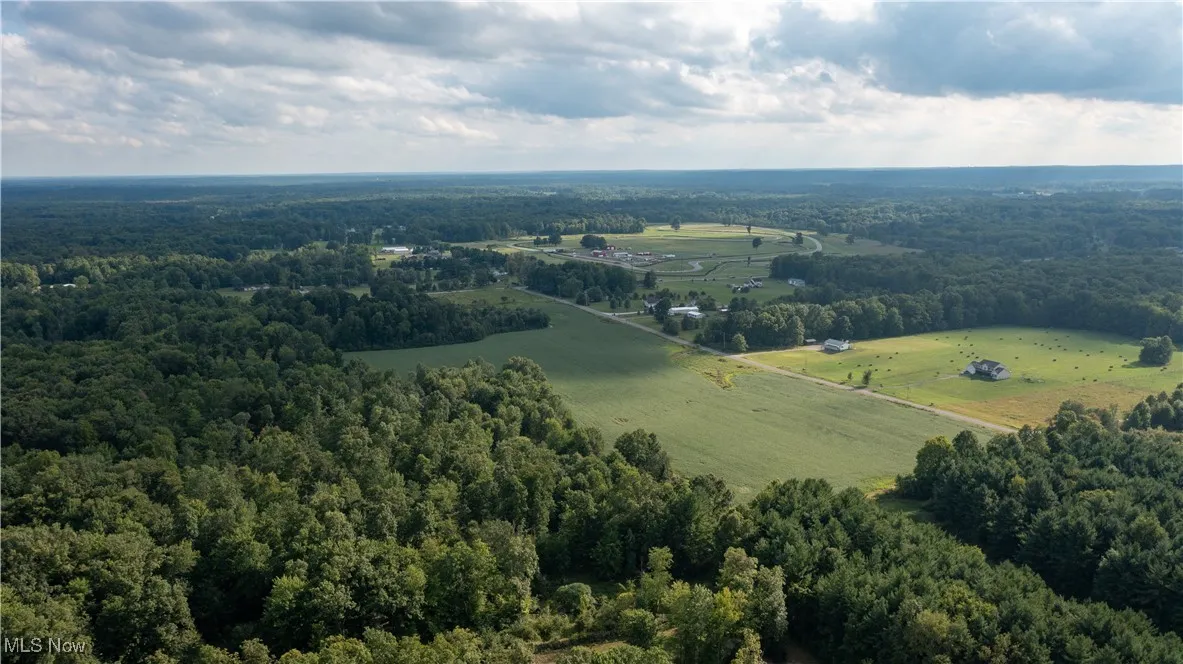 Birds eye view of property featuring a rural view