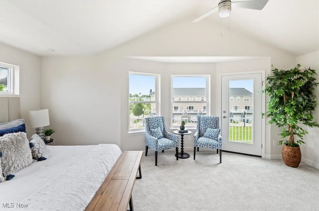 Bedroom featuring carpet floors, access to exterior, baseboards, and a ceiling fan
