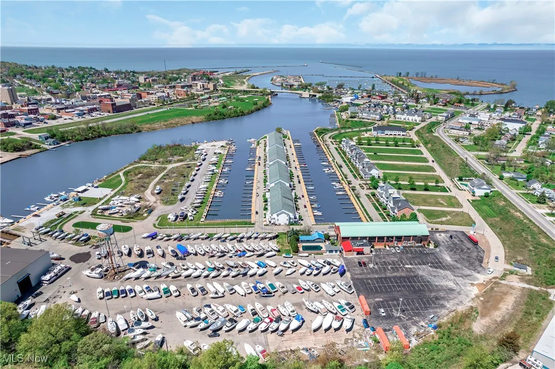 Aerial view of property's location featuring a large body of water