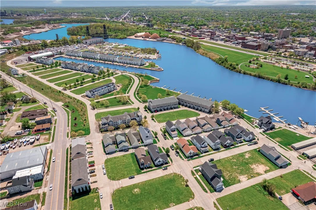 Aerial view of residential area featuring a large body of water
