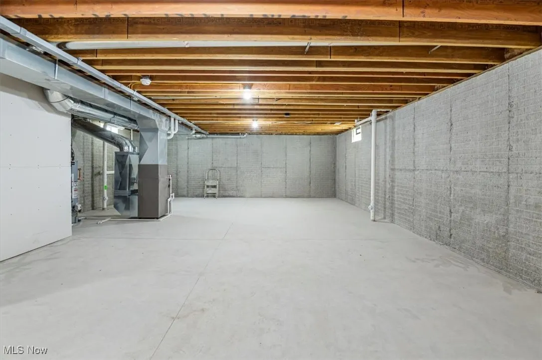 Unfinished below grade area with heating unit