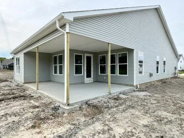Rear of home with view of covered patio