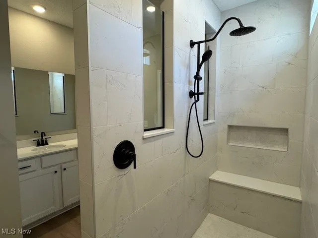 Bathroom with vanity and walk in shower