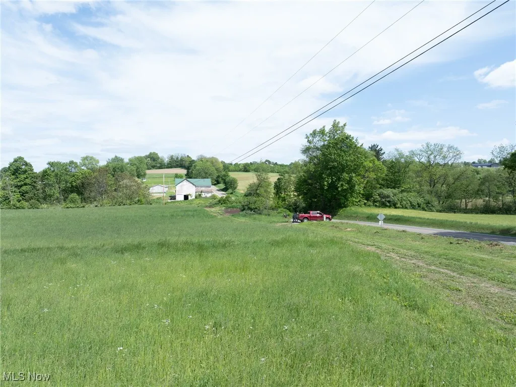 View of yard with a rural view