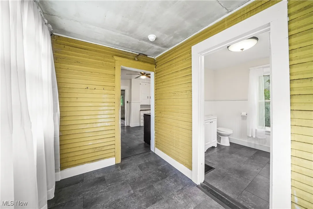 Hallway with wood walls