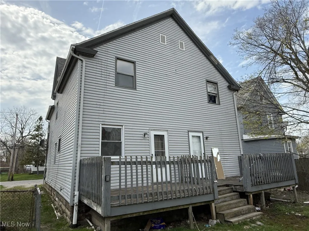 Rear view of house with a deck