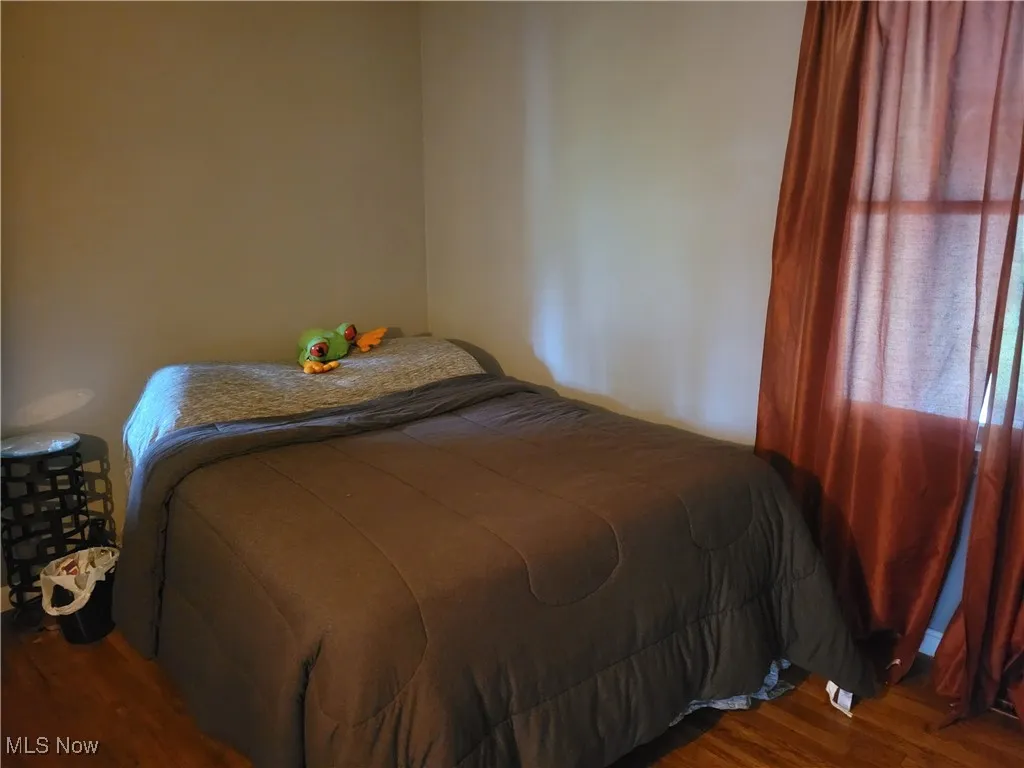 Bedroom featuring wood finished floors