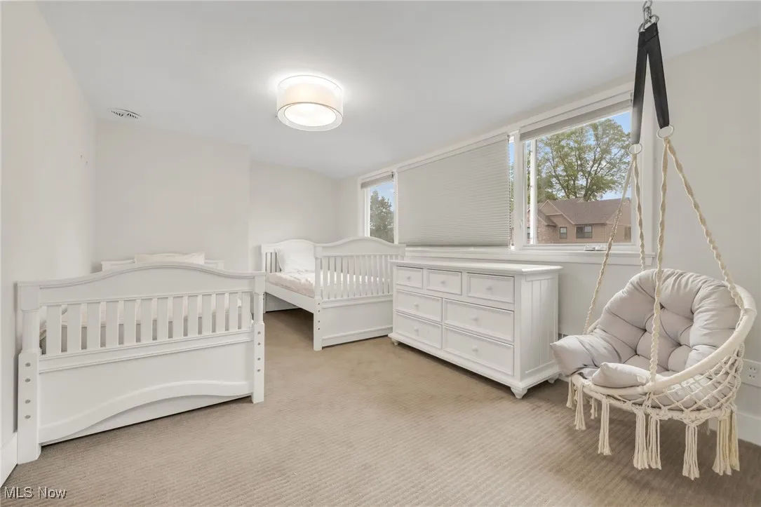 Bedroom with light carpet