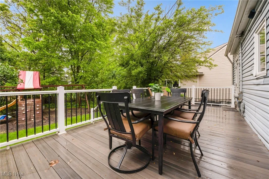 Wooden deck featuring outdoor dining space
