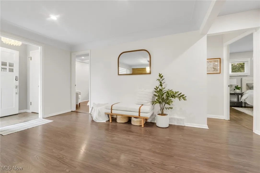 Foyer entrance featuring wood finished floors and baseboards