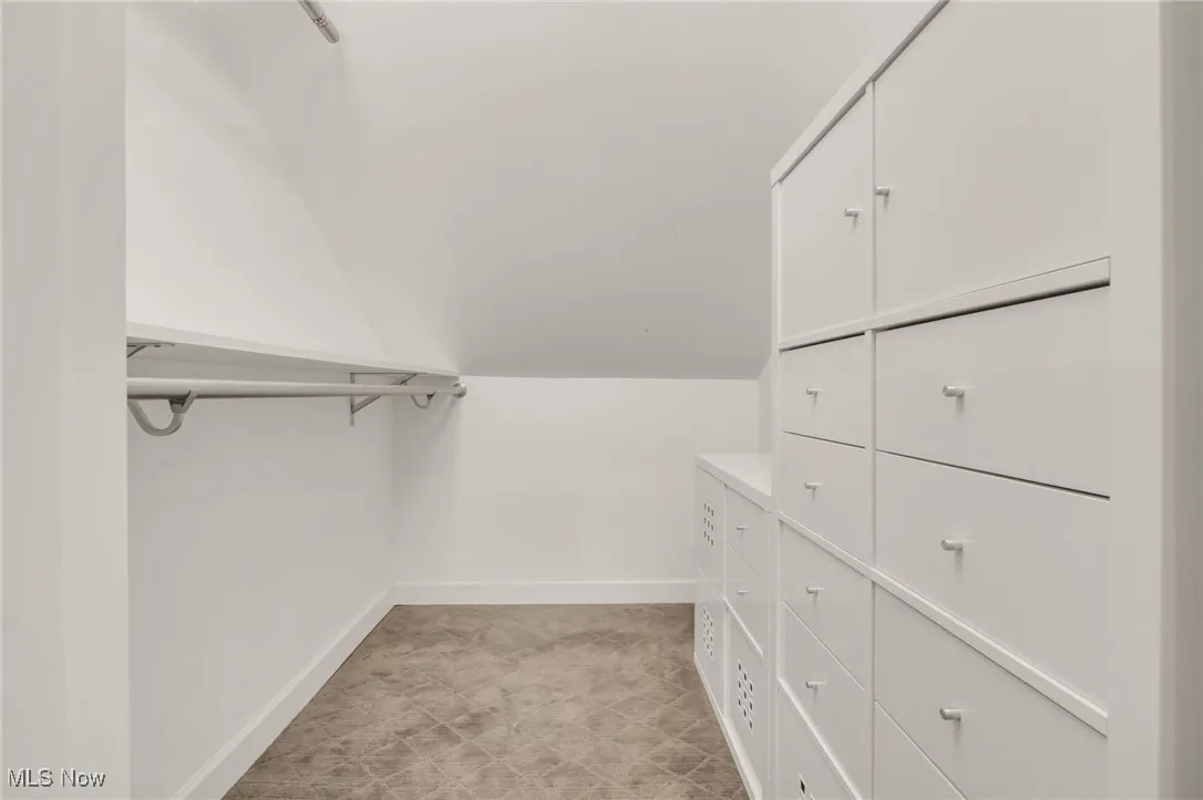 Spacious closet with lofted ceiling