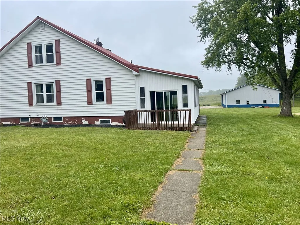 Back view of home with deck