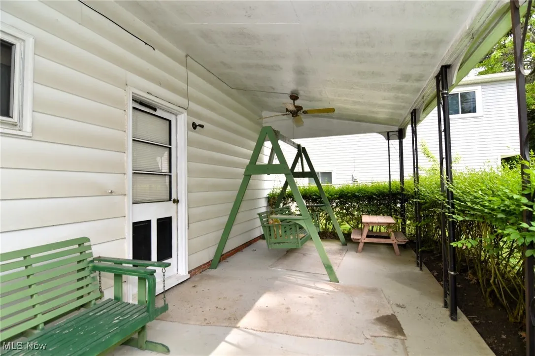 View of patio featuring a ceiling fan