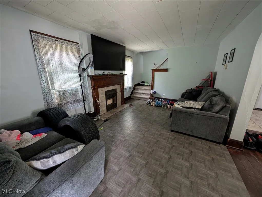 Living area with a tiled fireplace