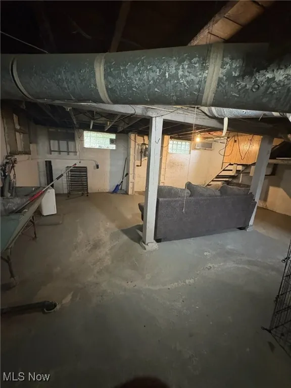Below grade area with stairs and plenty of natural light
