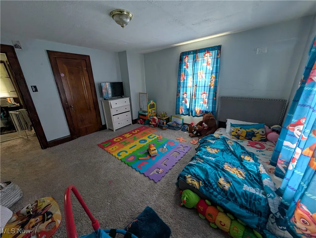 Bedroom featuring carpet flooring
