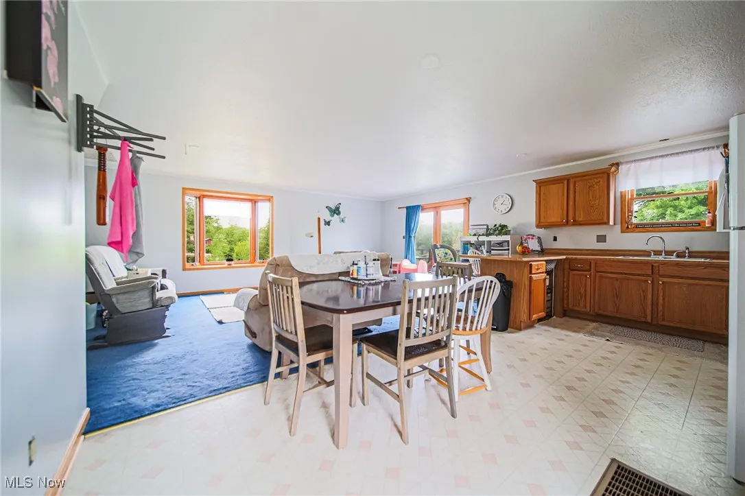Dining area with light flooring and baseboards