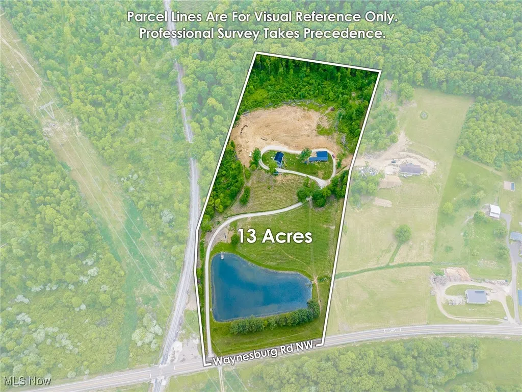 Aerial view of property and surrounding area with property parcel outlined