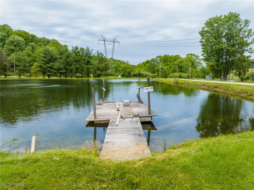 Dock featuring a water view