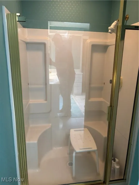 Bathroom featuring a shower stall
