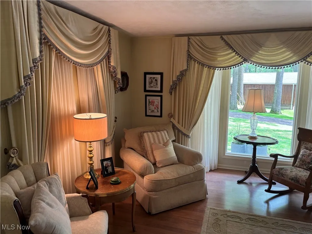 Sitting room featuring wood finished floors