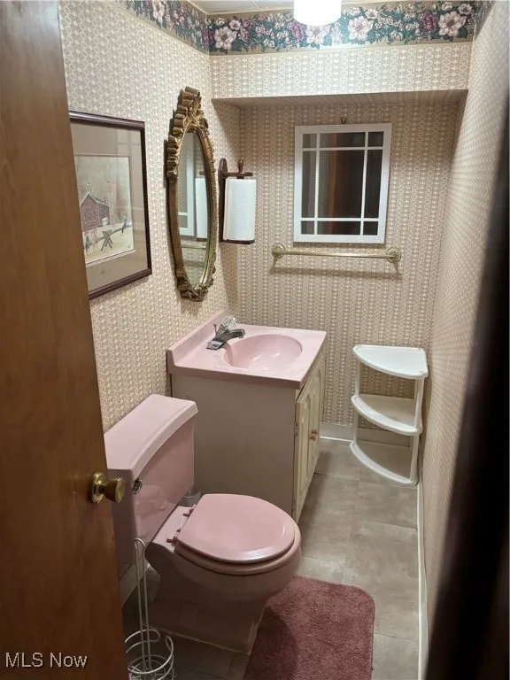 Bathroom with toilet and vanity