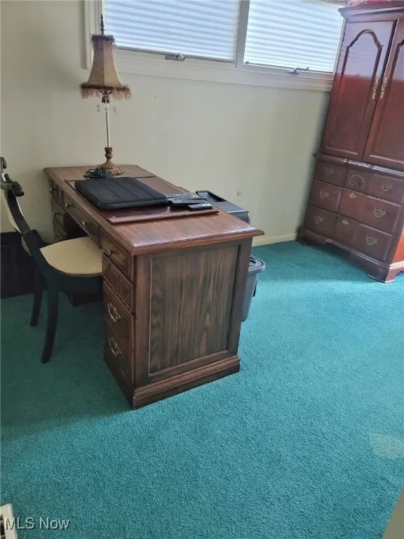 View of carpeted home office
