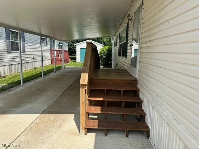 View of steps featuring a carport