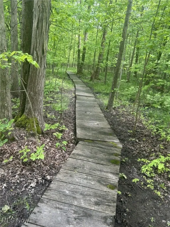 View of community with a wooded view