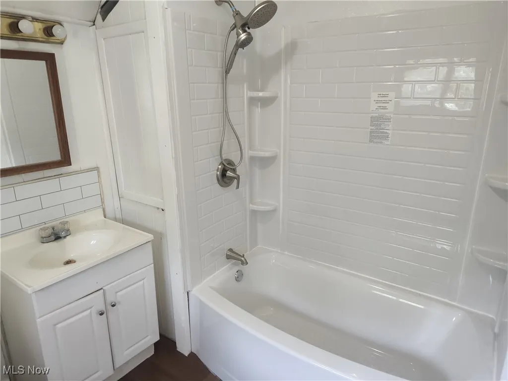 Bathroom featuring vanity and bathtub / shower combination