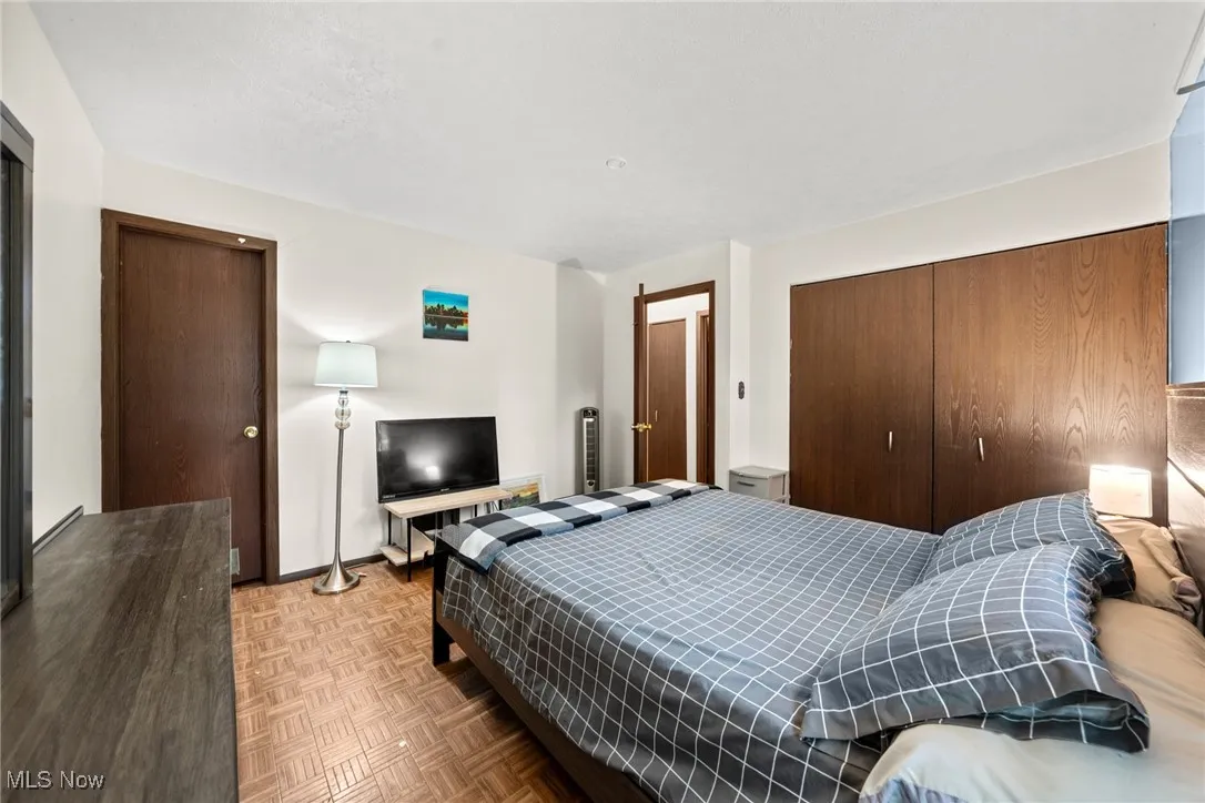 Bedroom with a closet and baseboards