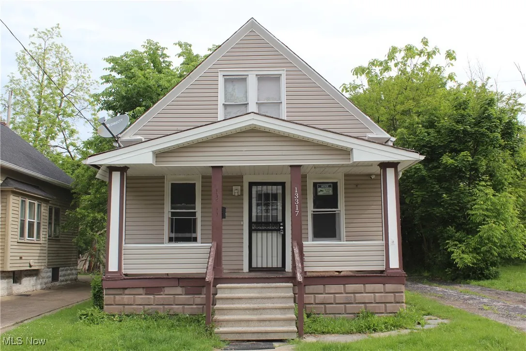 Bungalow-style house featuring covered porch