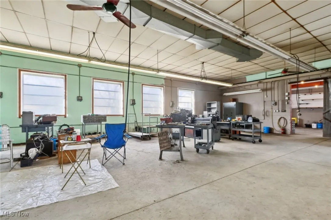Garage featuring ceiling fan