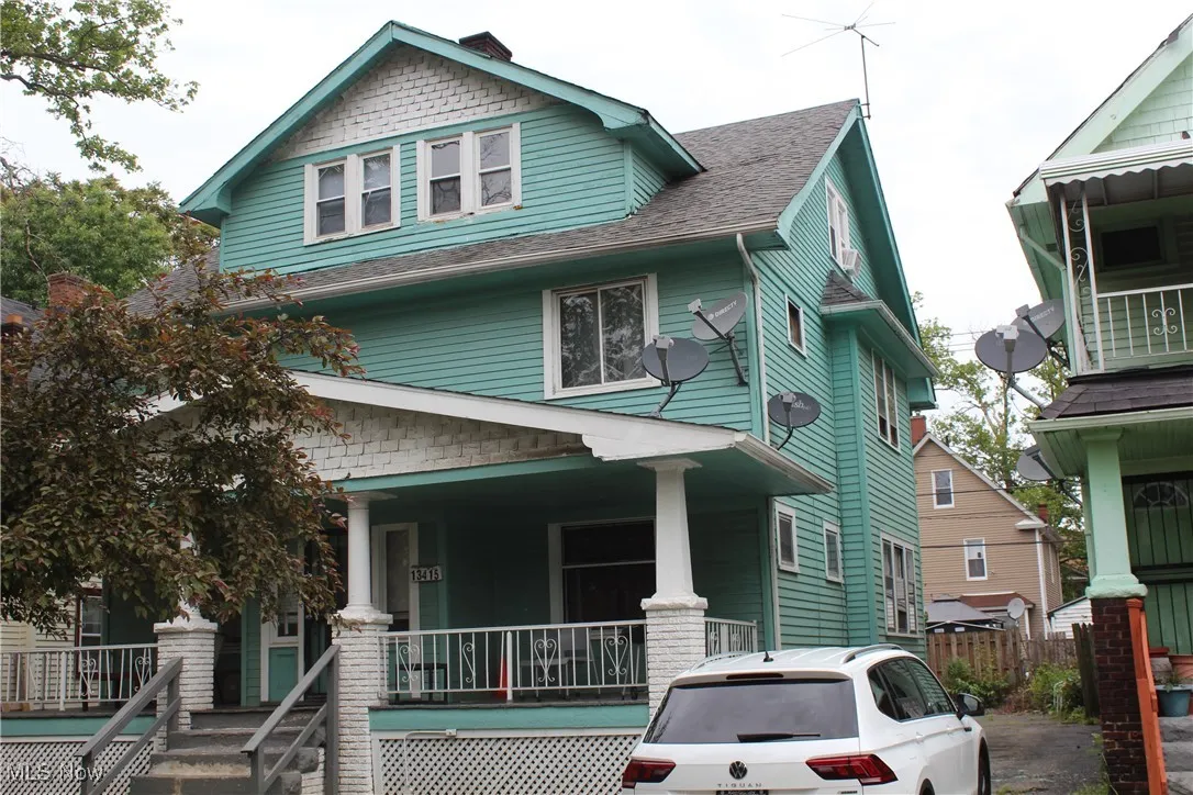 View of front of property featuring covered porch and roof with shingles