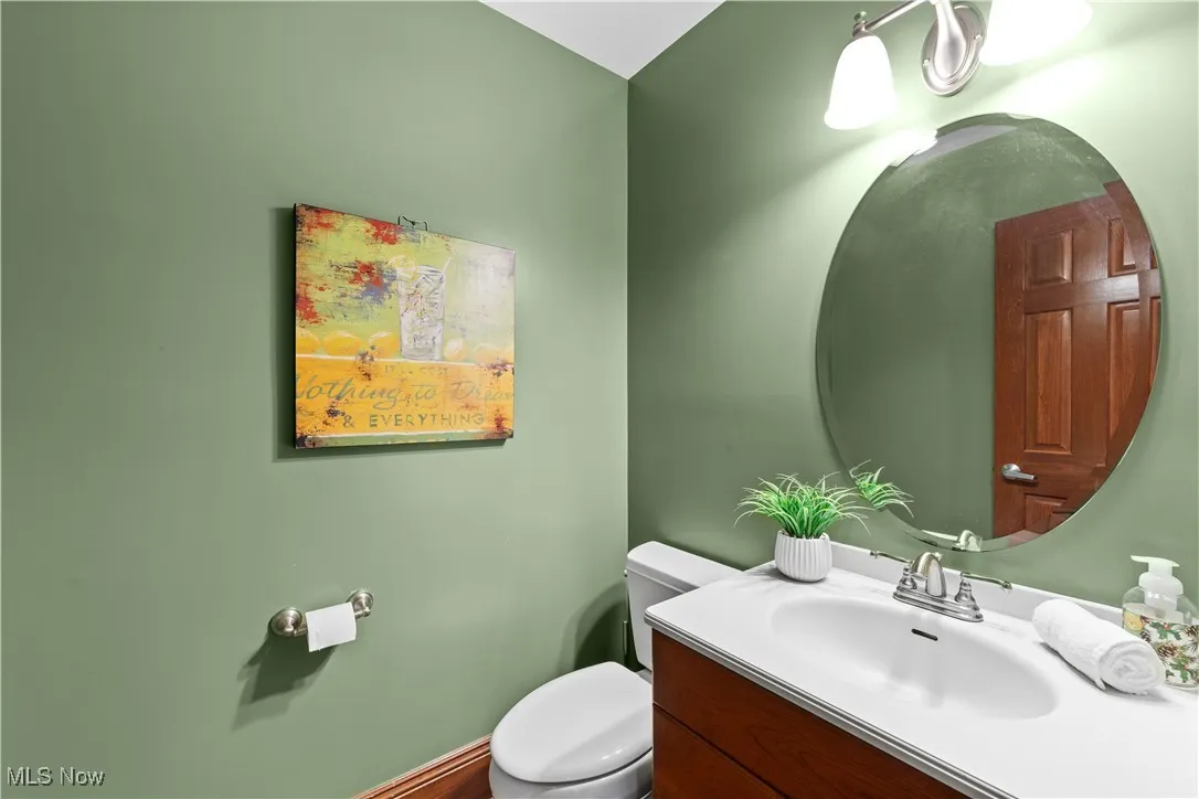 1st floor half bath by garage entrance