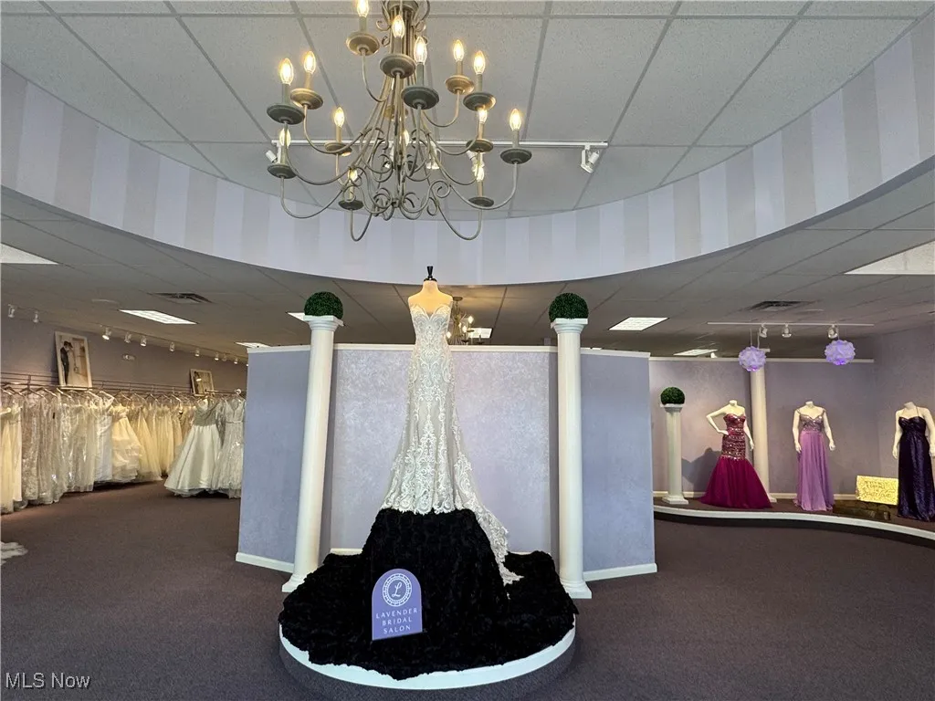Common area with wallpapered walls