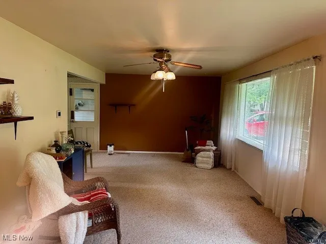  featuring ceiling fan and light colored carpet
