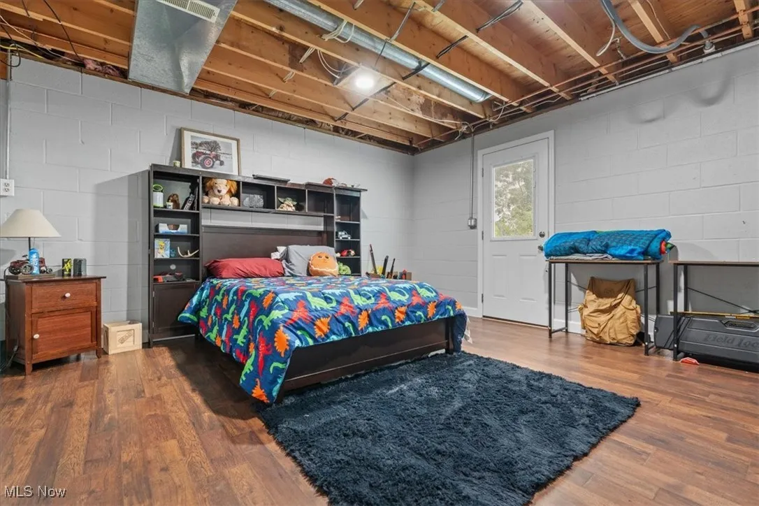 Lower level bonus room currently used as a fuest room.  With a separate exterior entrance this could easily be an office for a professional who needs space to meet with clients without them coming into the family space.